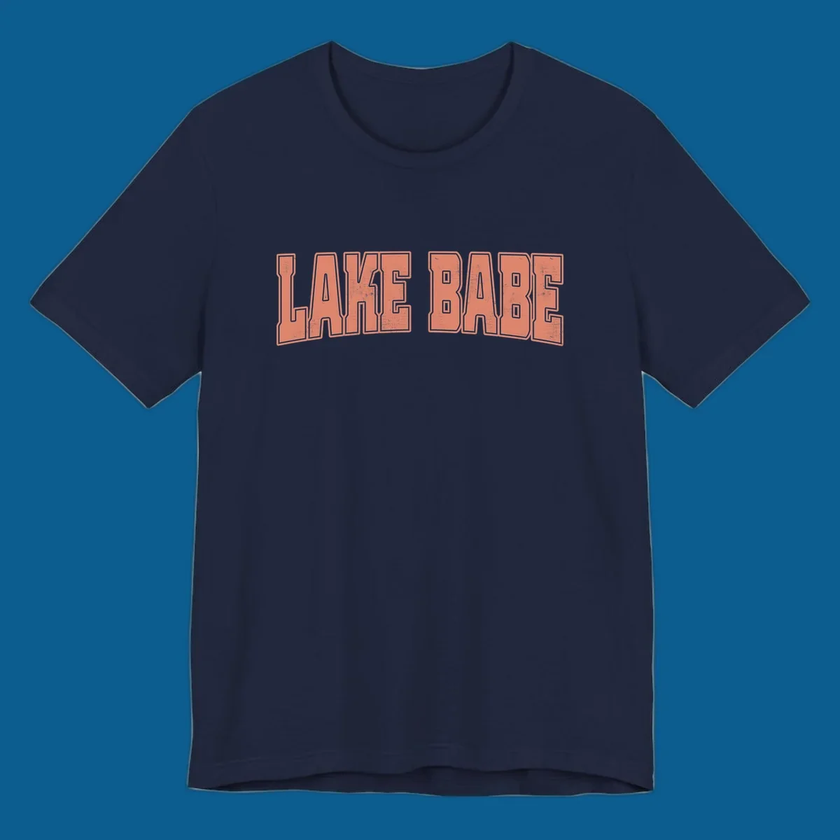 Lake Babe text in coral with distressed texture and thick outline, on black and white backgrounds.