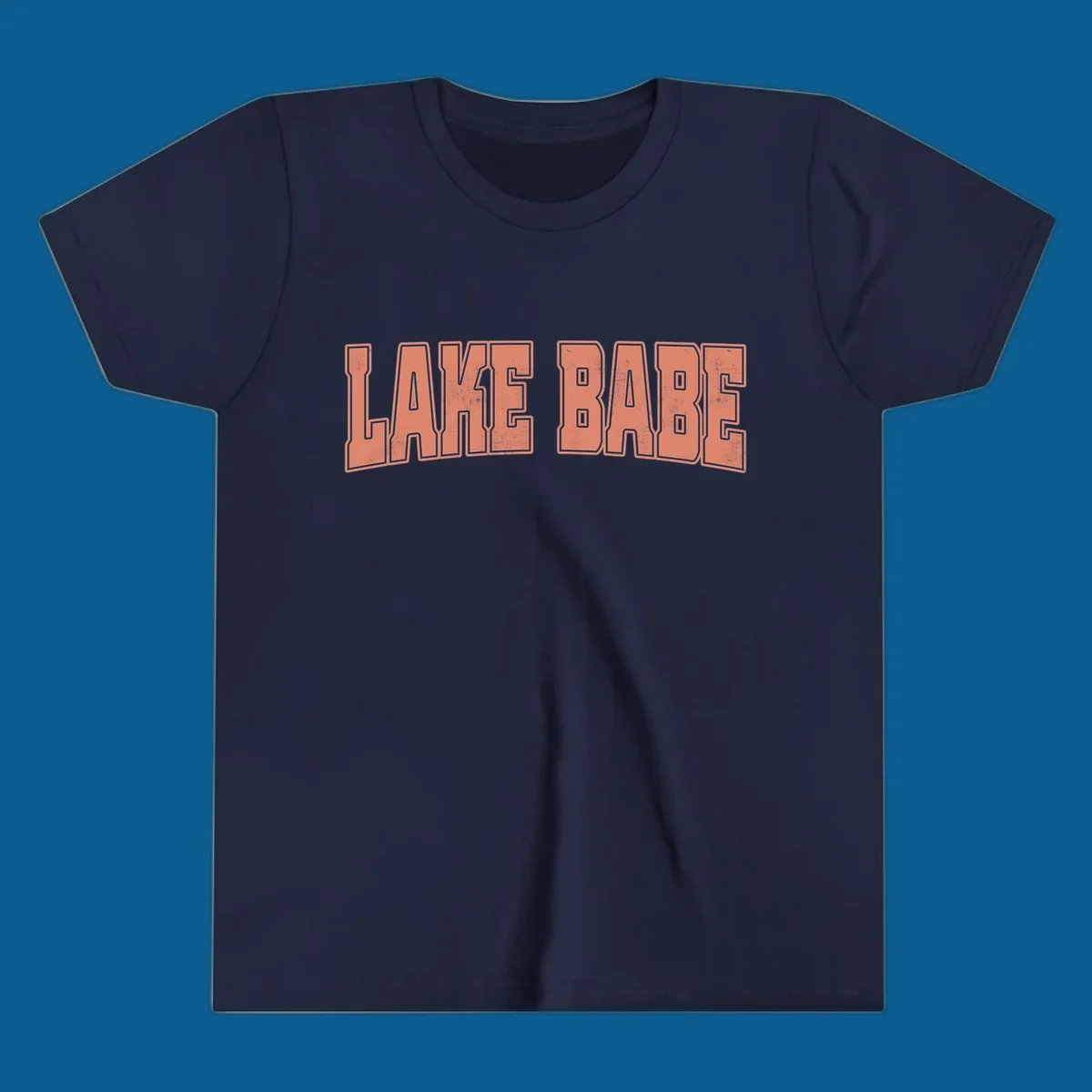Lake Babe text in coral with distressed texture and thick outline, on black and white backgrounds.