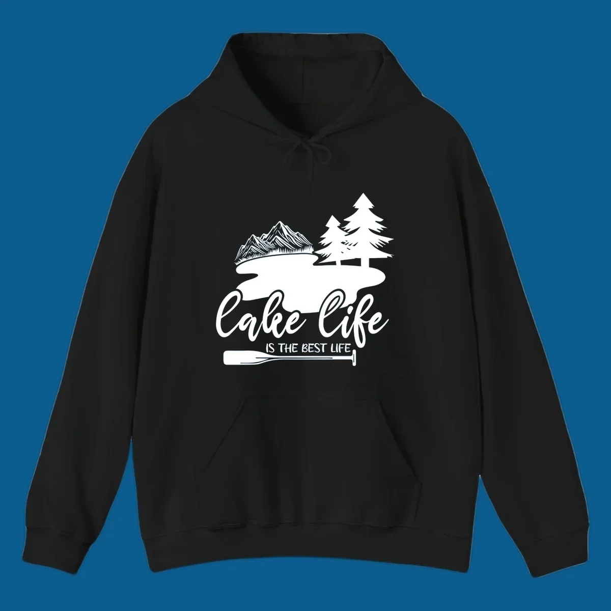 Lake life is the best life design with mountains, trees, lake, and paddle graphic.
