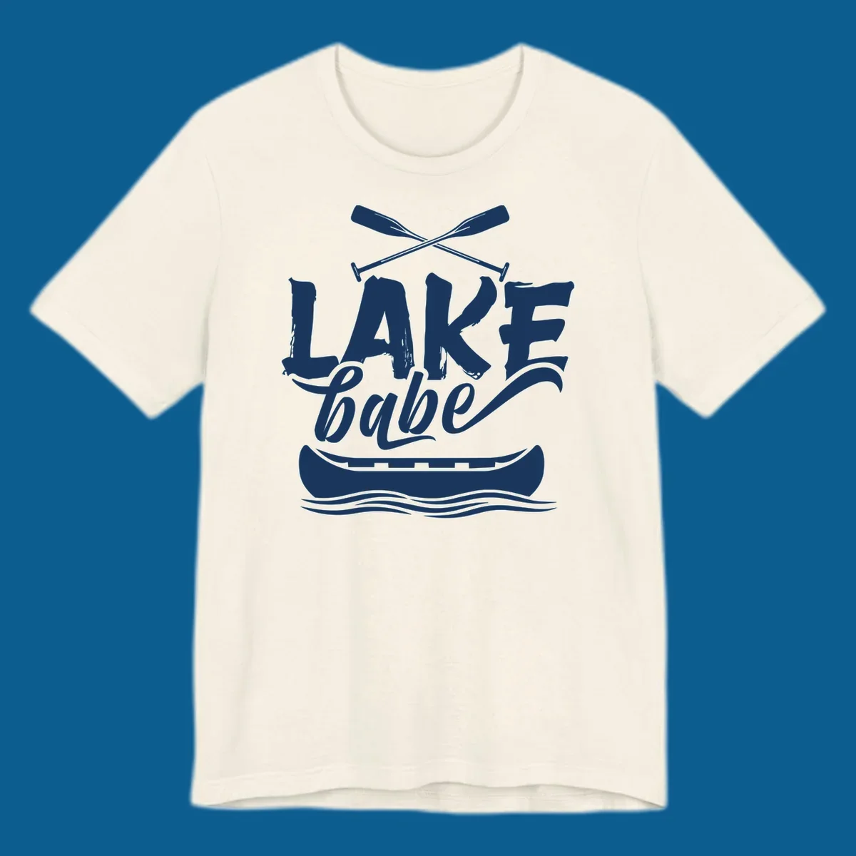 Lake babe text with canoe and oars on water. Primary keyword: lake-babe-canoe