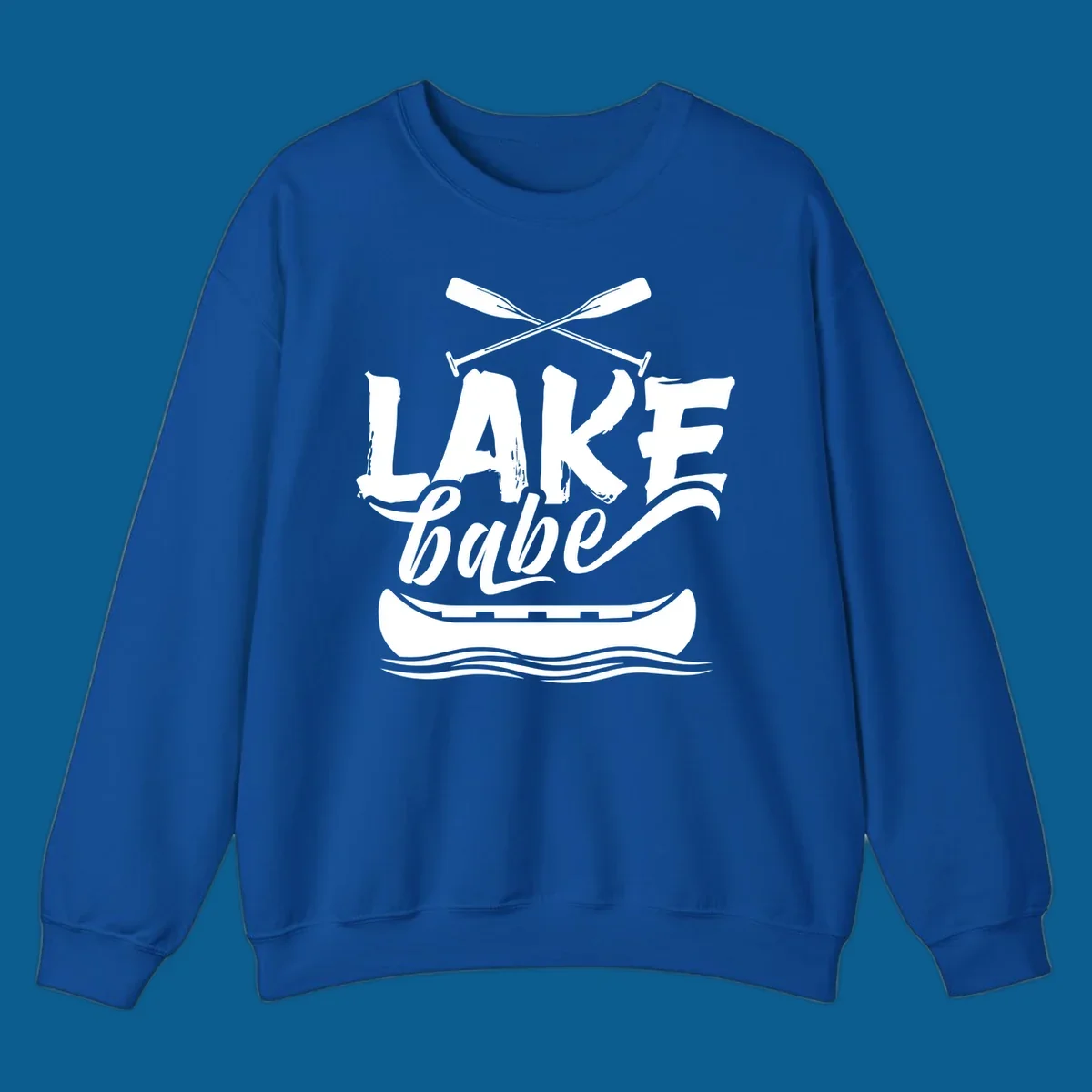 Lake babe text with canoe and oars on water. Primary keyword: lake-babe-canoe
