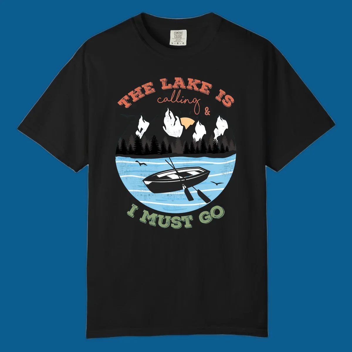 The lake is calling and I must go mountain lake scene with rowboat graphic