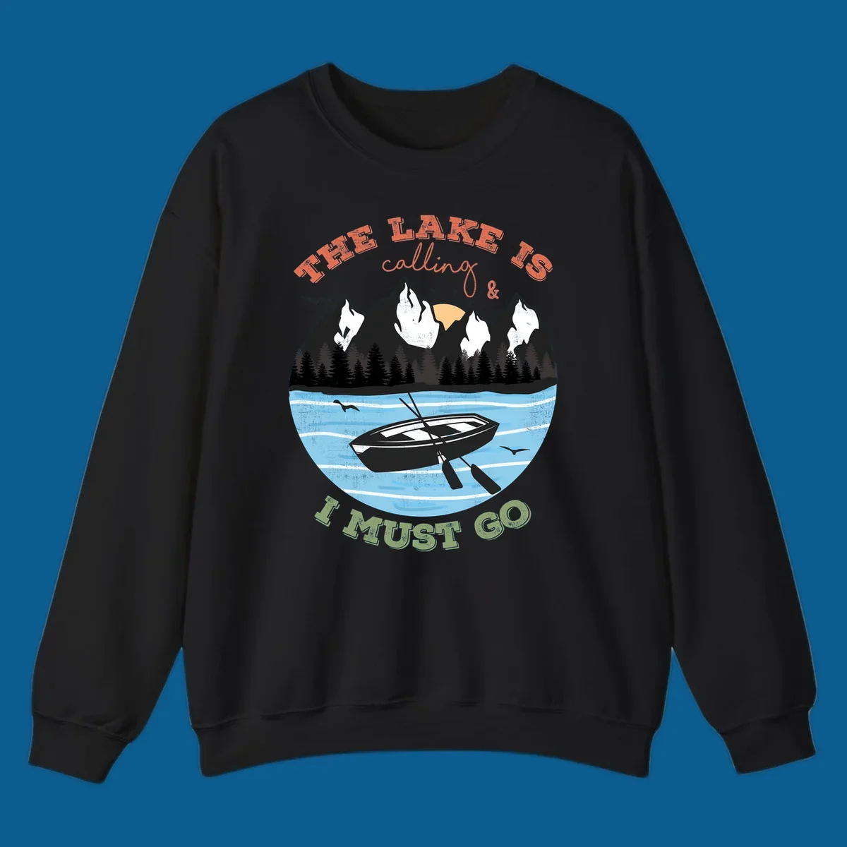The lake is calling and I must go mountain lake scene with rowboat graphic
