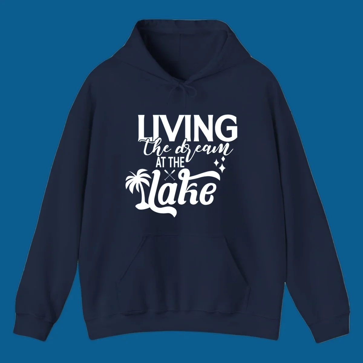 Living the dream at the lake text with palm tree and oars graphic