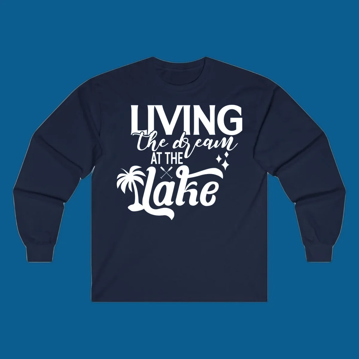 Living the dream at the lake text with palm tree and oars graphic