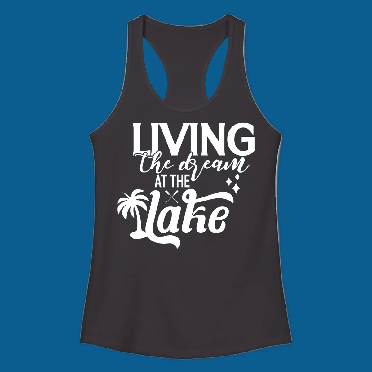 Living the dream at the lake text with palm tree and oars graphic