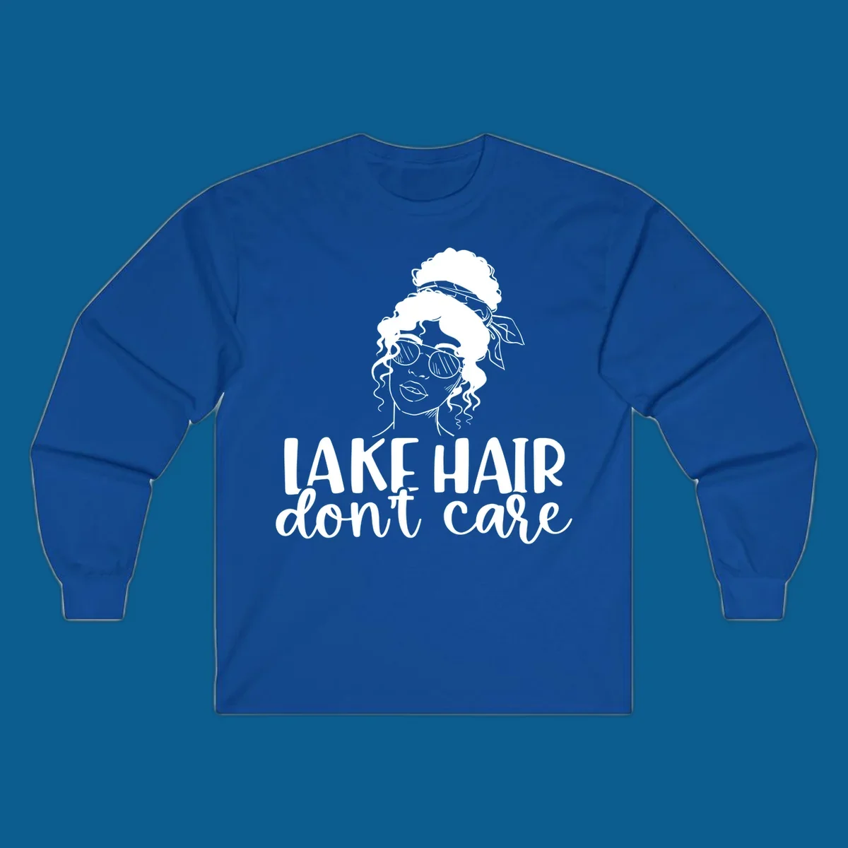 Illustration of a woman with sunglasses and messy bun, with text 'Lake Hair Don't Care'.