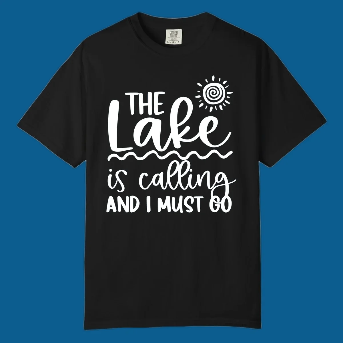 The lake is calling and I must go typography with sun and waves graphic