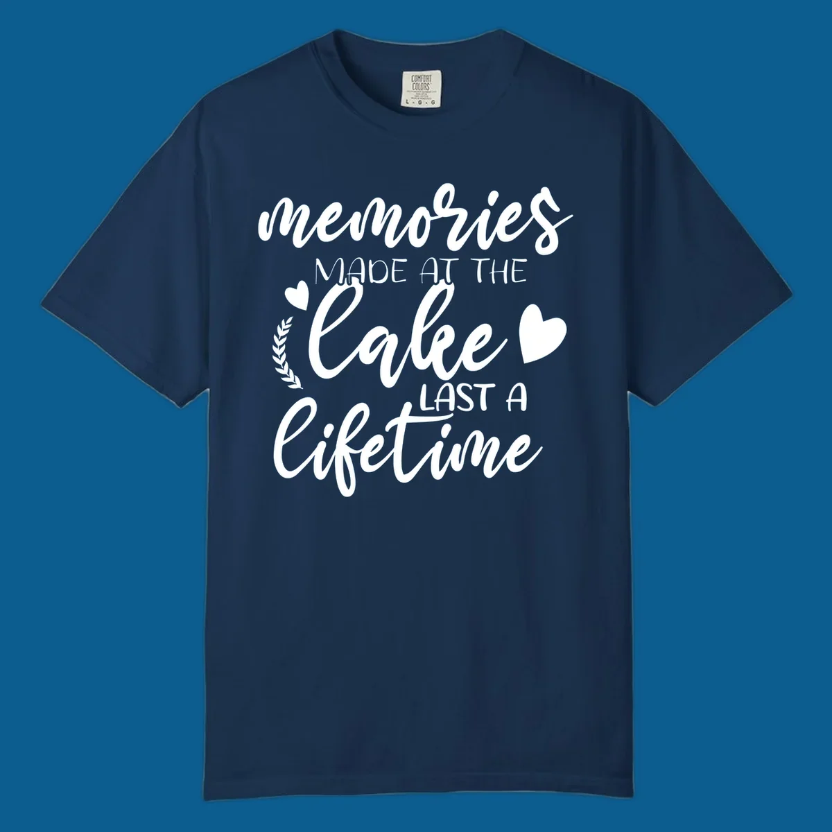 Lake life memories text design with hearts and laurel wreath.