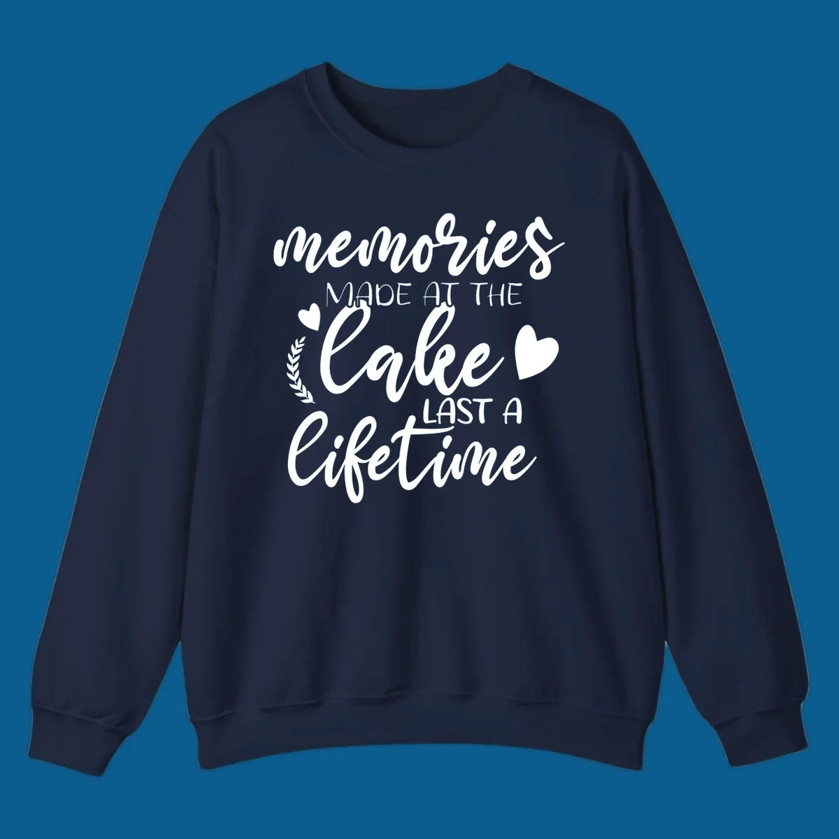 Lake life memories text design with hearts and laurel wreath.