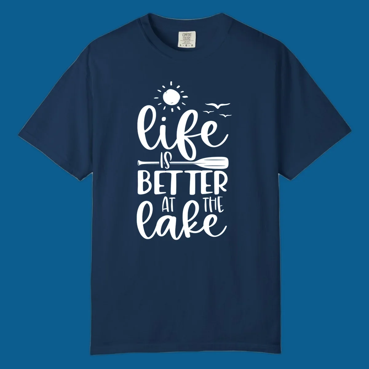 Life is better at the lake quote with sun, birds, and oar graphic.
