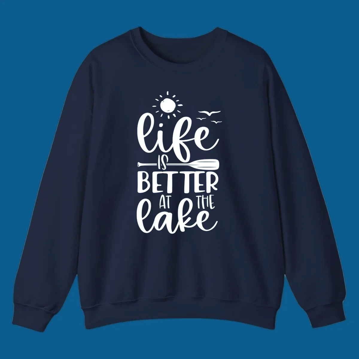 Life is better at the lake quote with sun, birds, and oar graphic.