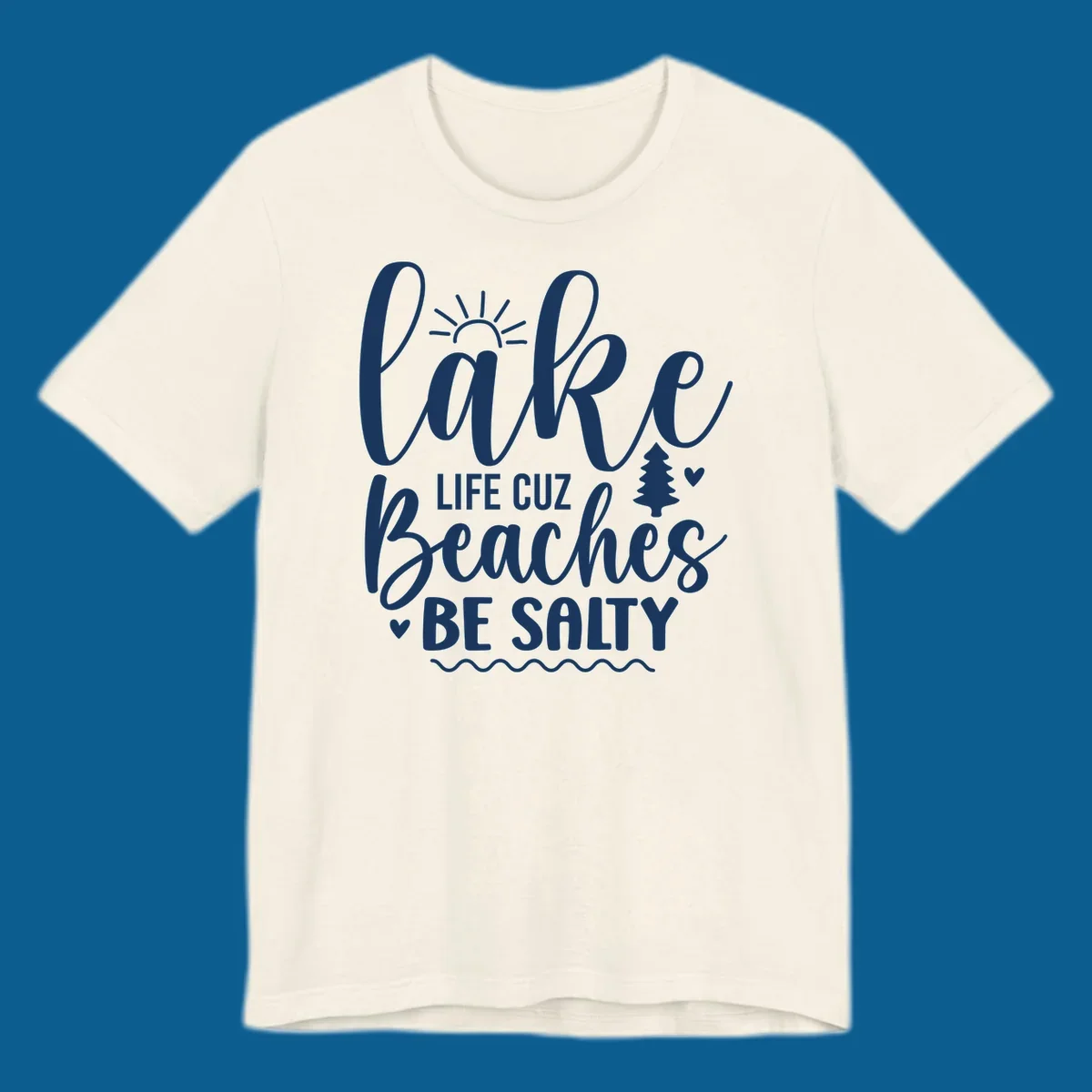 Lake life cuz beaches be salty text design with sun and tree elements.