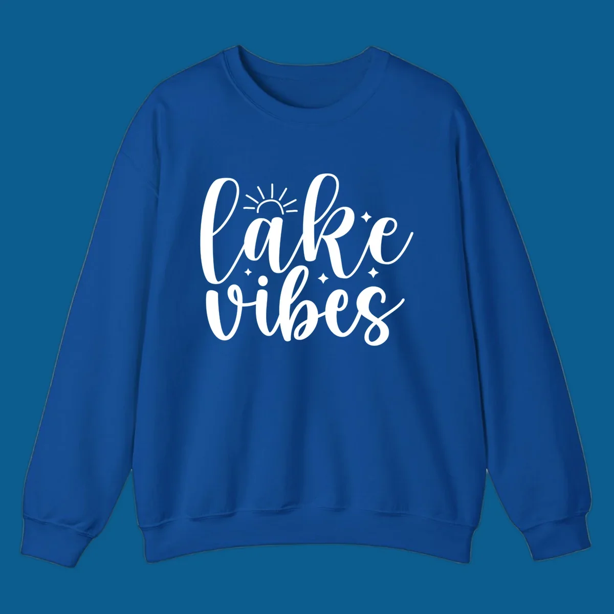 White script text that reads 'lake vibes' with sun and sparkle graphics, representing the lake-vibes-script concept.