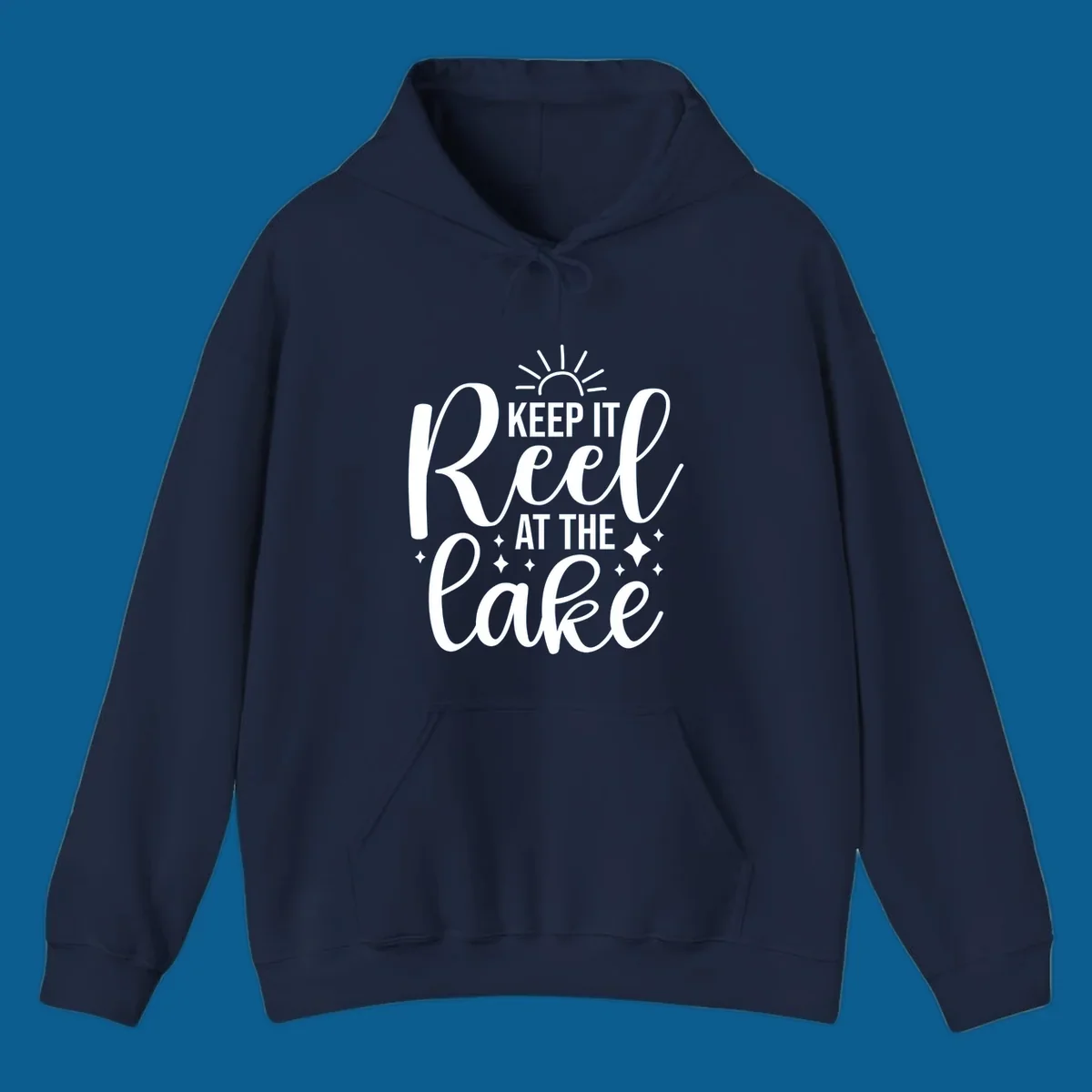 Keep It Reel At The Lake design with sun rays and sparkles, a lakeside lifestyle graphic.