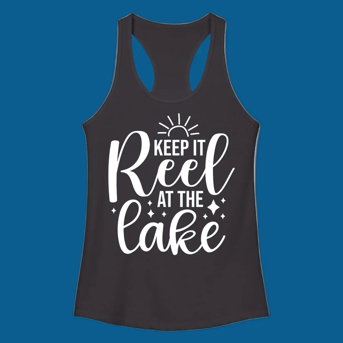 Keep It Reel At The Lake design with sun rays and sparkles, a lakeside lifestyle graphic.