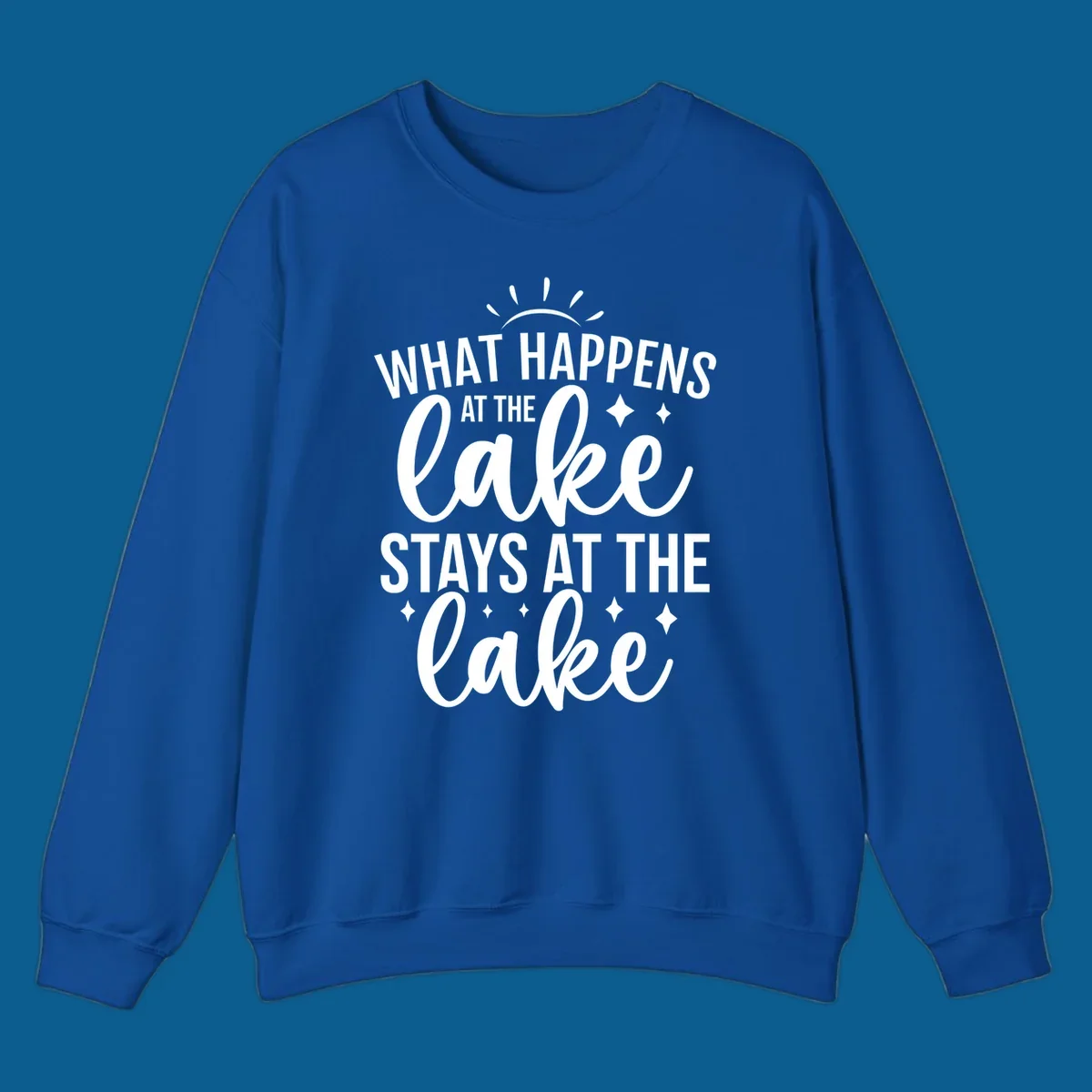 What happens at the lake stays at the lake quote design with sparkle stars.