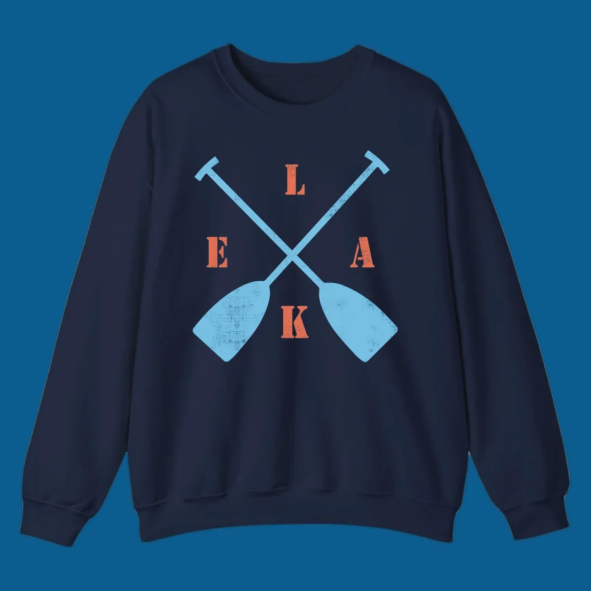 Crossed kayak paddles with letters spelling LAKE, representing lake-kayak-life.