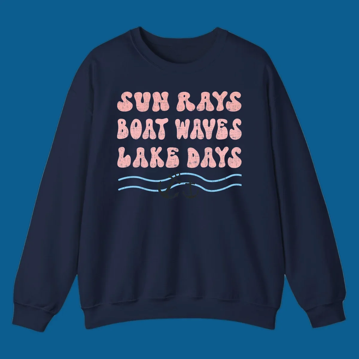 Lake days boat waves sun rays text with anchors and waves.