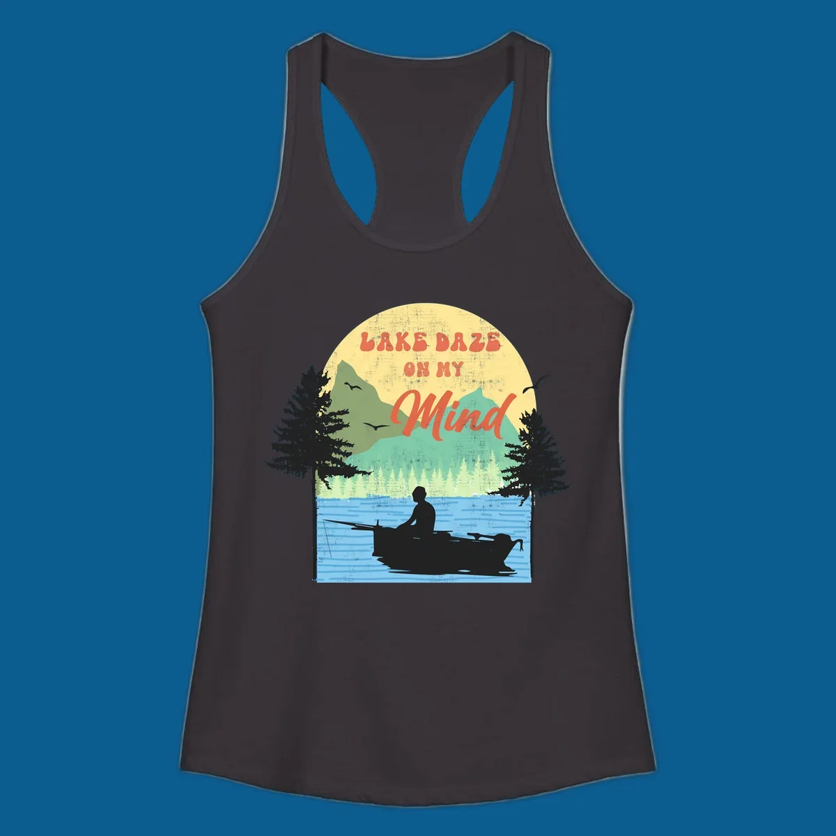 Lake daze fishing design featuring a person in a boat on a lake with trees and mountains.
