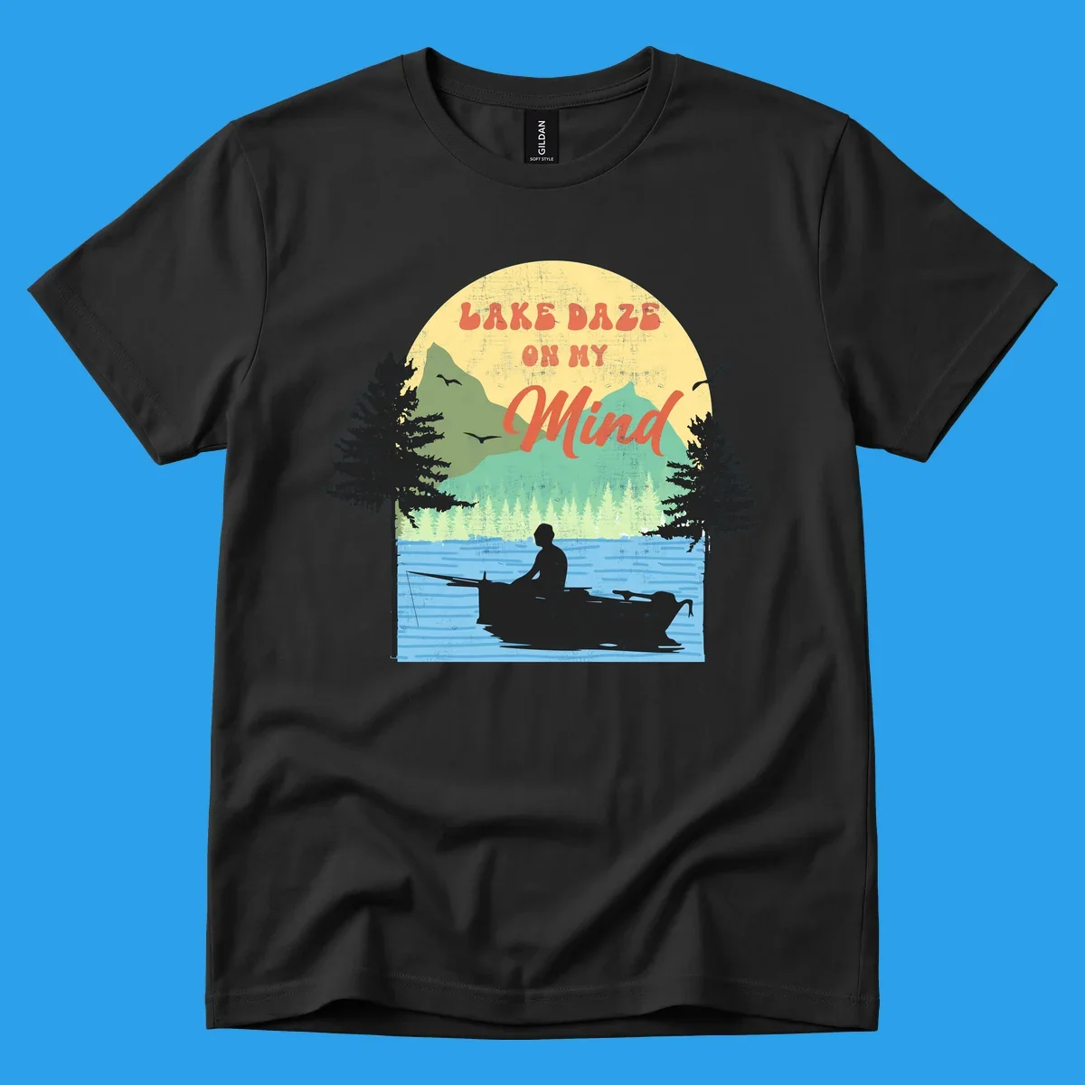 Lake daze fishing design featuring a person in a boat on a lake with trees and mountains.