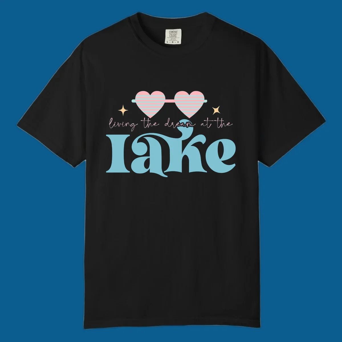 Living the dream lake life design with heart sunglasses and retro lettering.