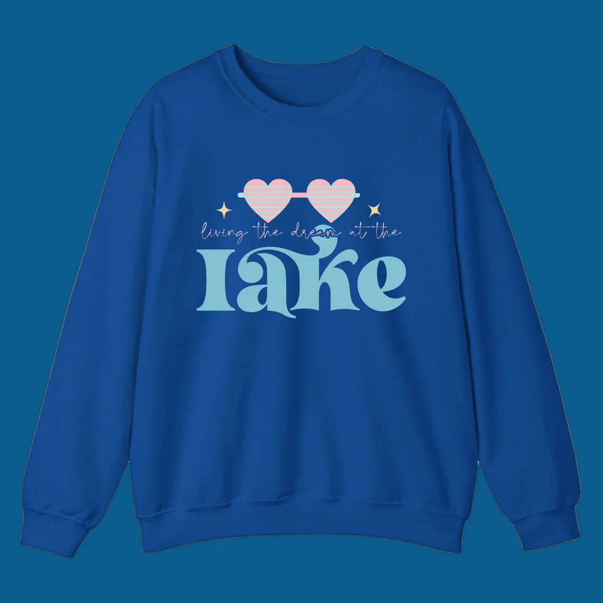 Living the dream lake life design with heart sunglasses and retro lettering.