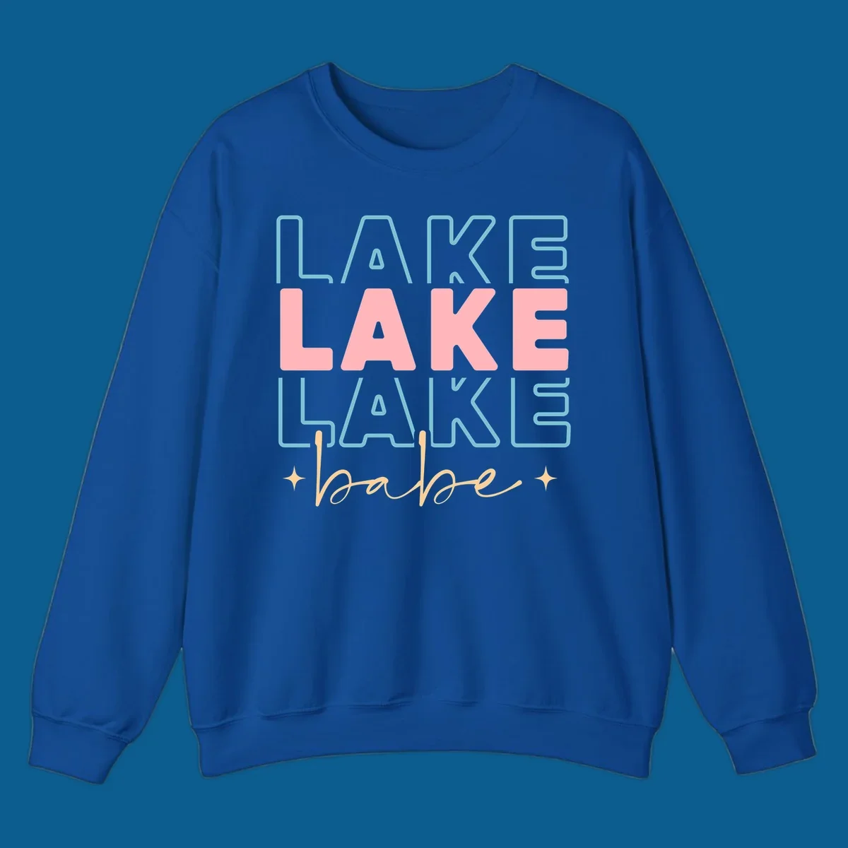 Retro typography design featuring the words LAKE LAKE LAKE and babe, with gold starburst accents.