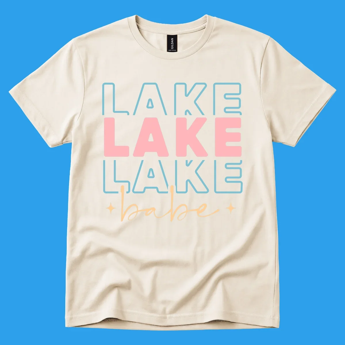 Retro typography design featuring the words LAKE LAKE LAKE and babe, with gold starburst accents.