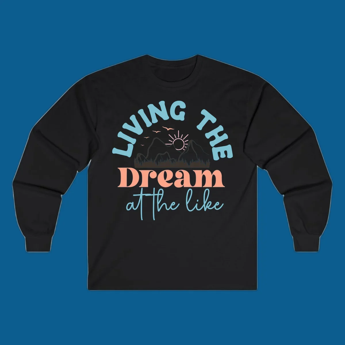 Illustration of mountains with a sunrise and birds above the text 'Living The Dream At The Like'.
