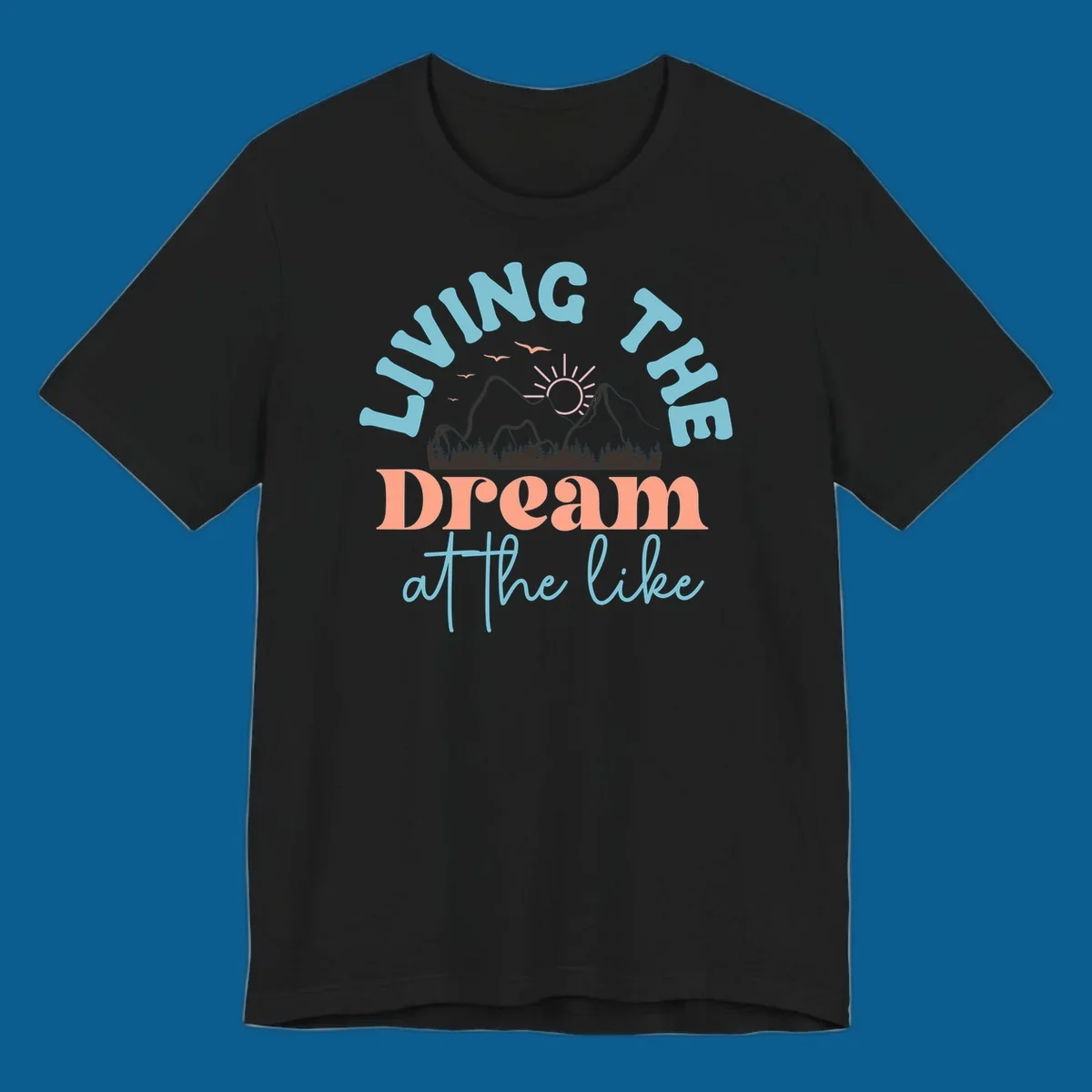 Illustration of mountains with a sunrise and birds above the text 'Living The Dream At The Like'.