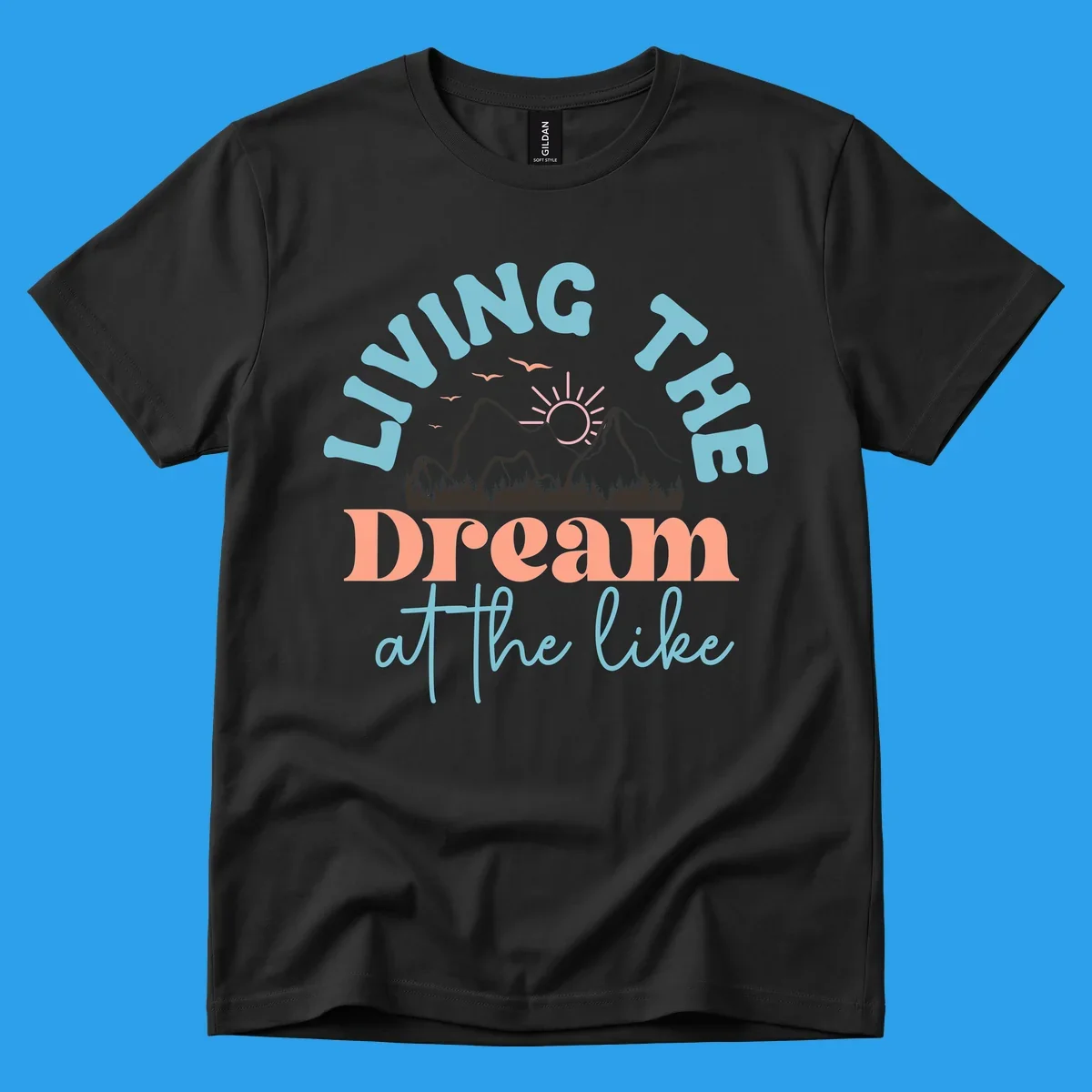 Illustration of mountains with a sunrise and birds above the text 'Living The Dream At The Like'.