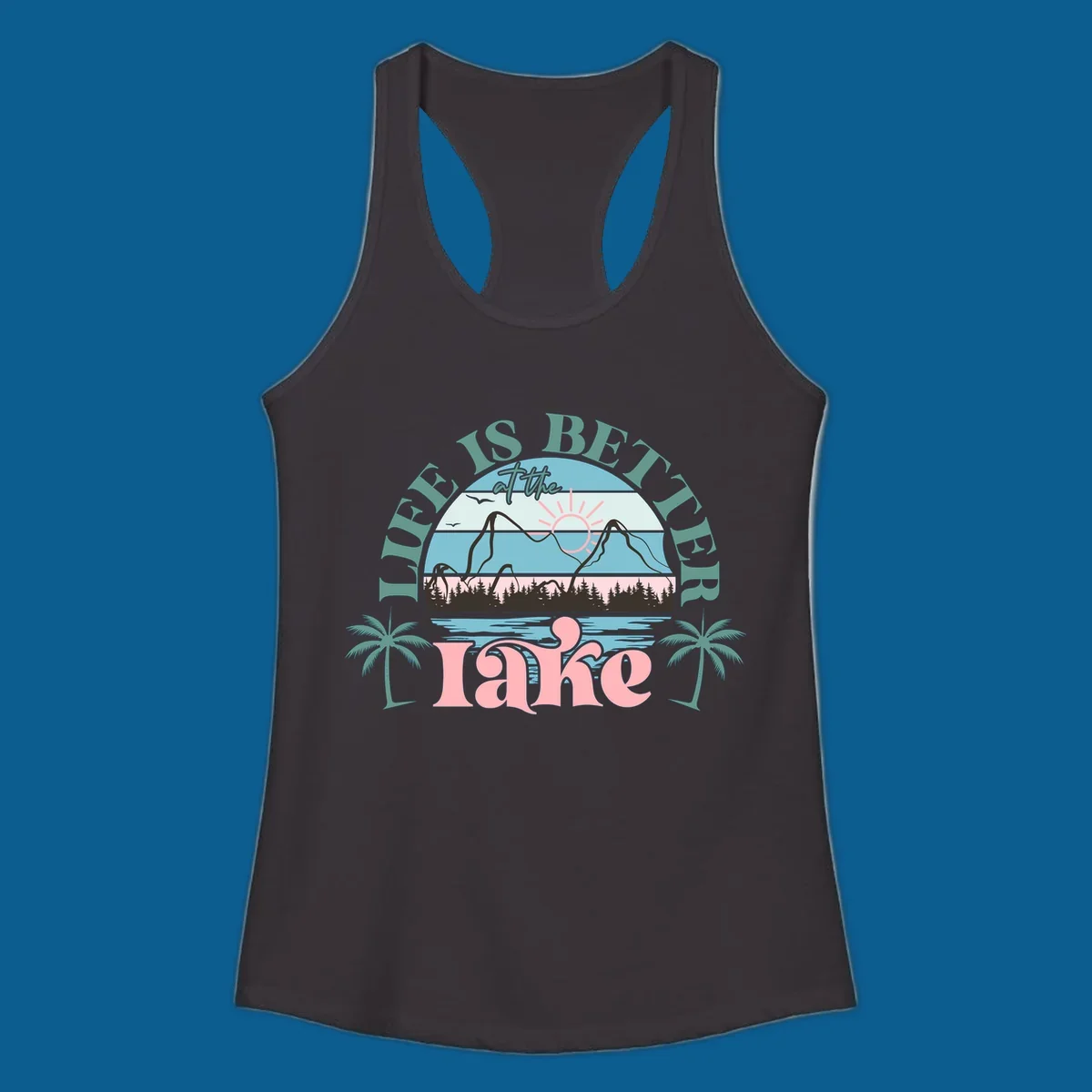 Life is better at the lake scenic design with mountains, trees, lake, and palm trees.