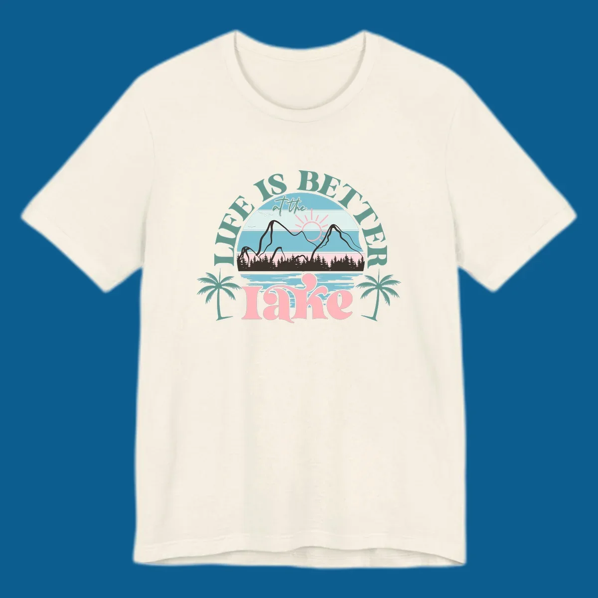 Life is better at the lake scenic design with mountains, trees, lake, and palm trees.