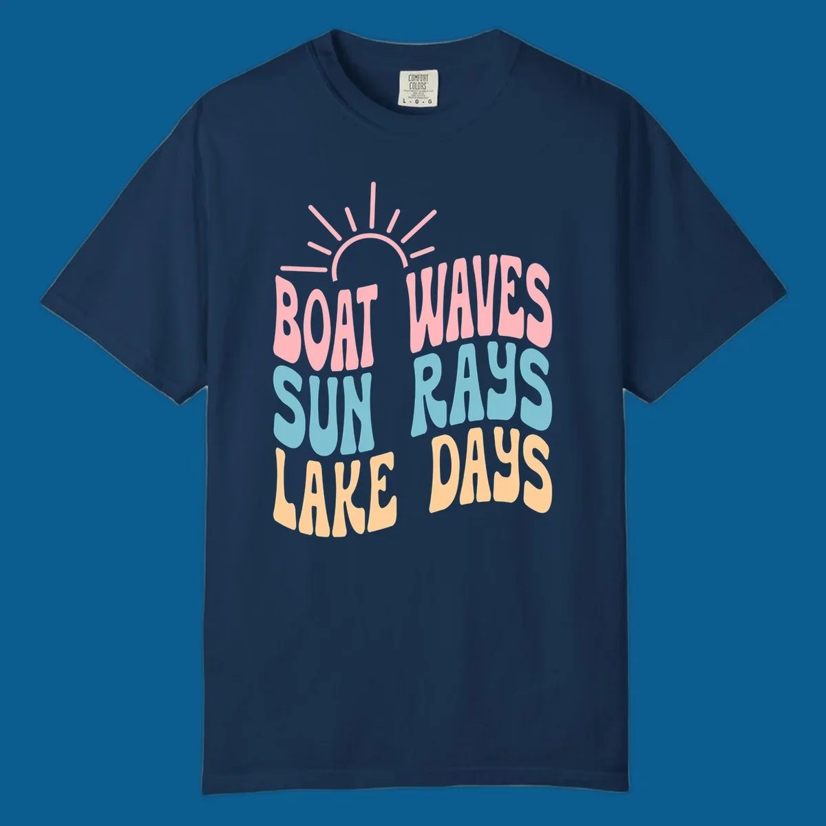 Retro text design featuring 'Boat Waves Sun Rays Lake Days' with sun rays.