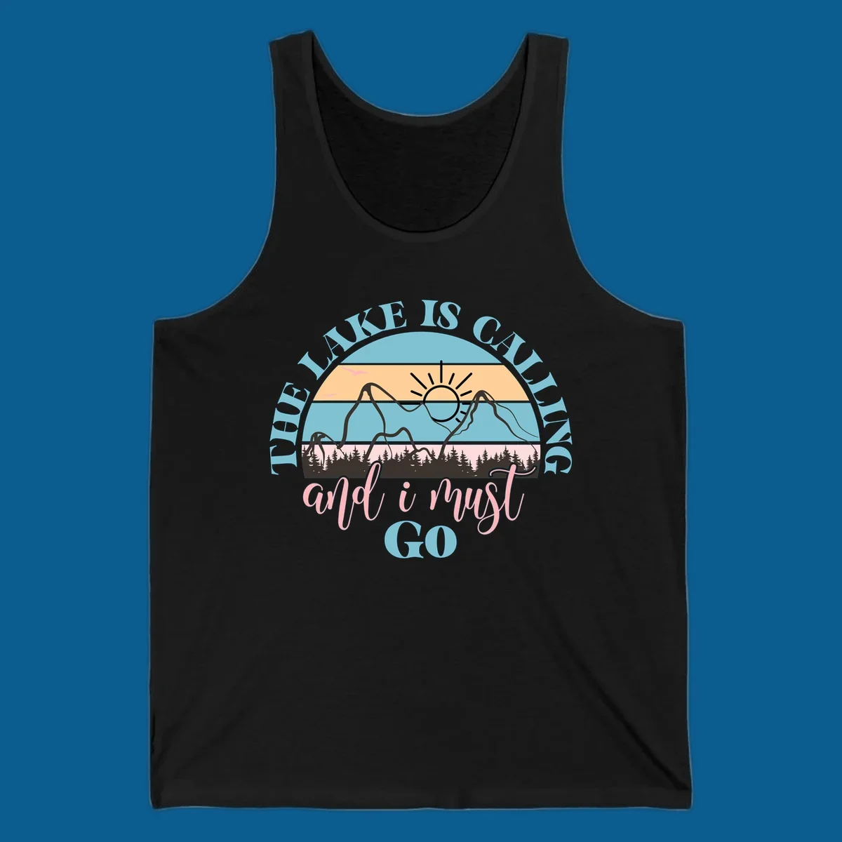 The Lake Is Calling And I Must Go text with mountain and sunset illustration.