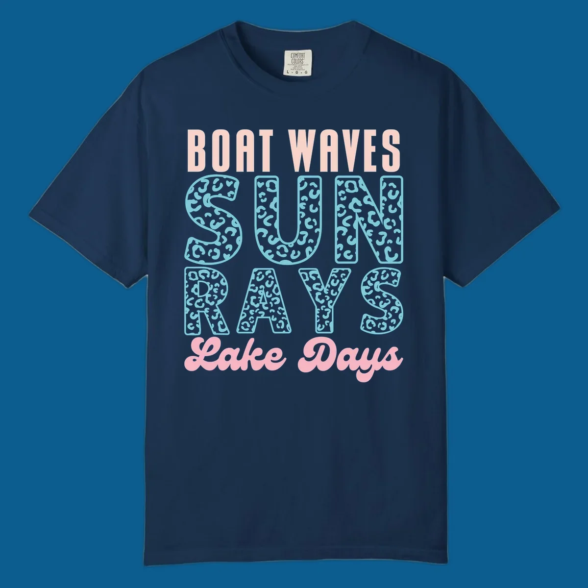 Boat waves sun rays lake days text design with pink and teal leopard print.