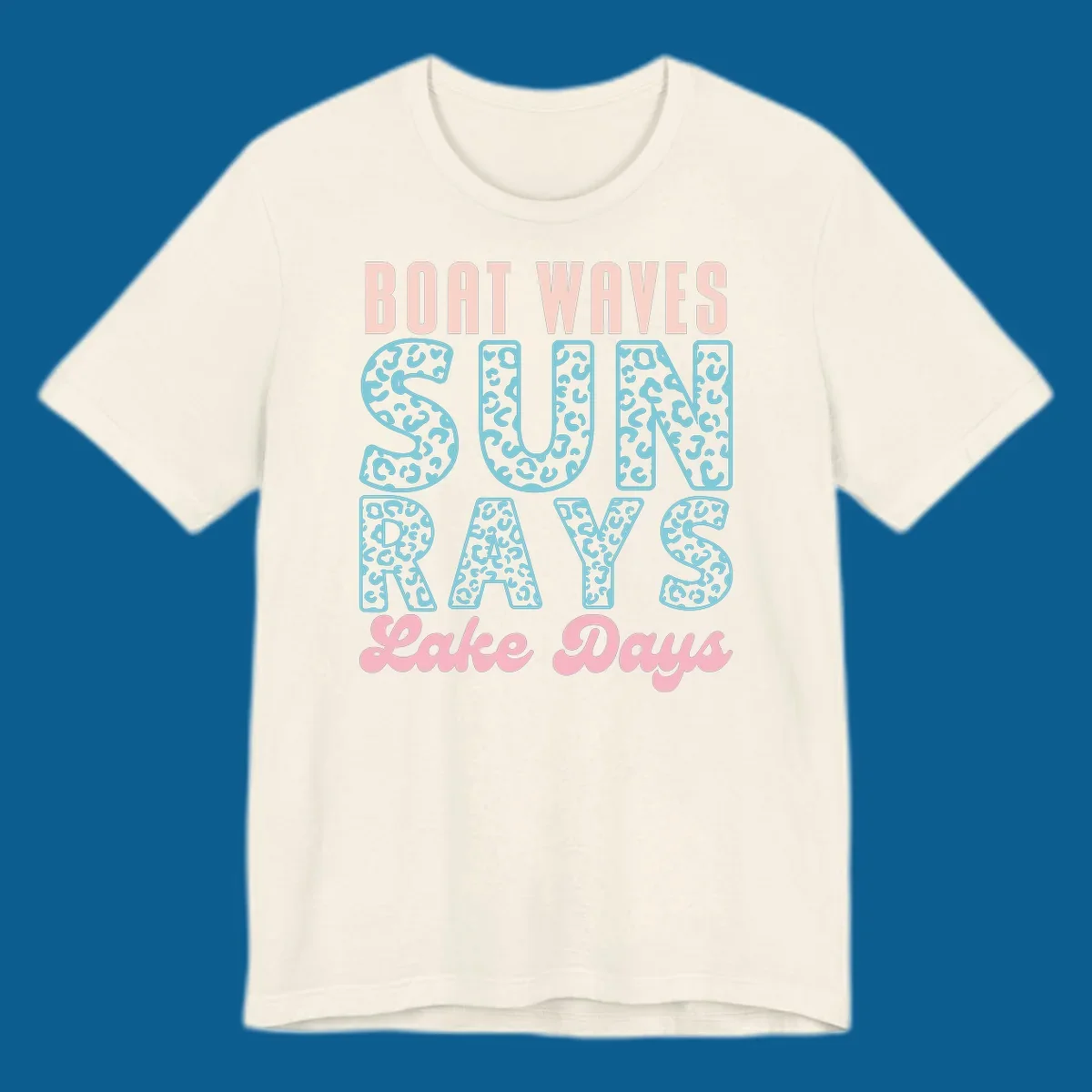 Boat waves sun rays lake days text design with pink and teal leopard print.