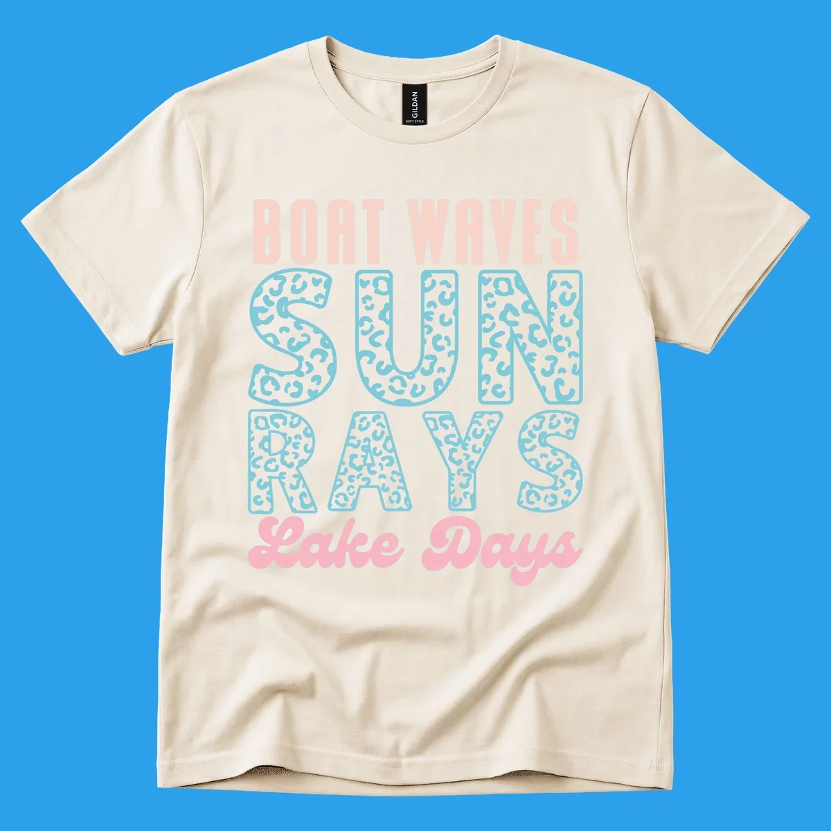 Boat waves sun rays lake days text design with pink and teal leopard print.