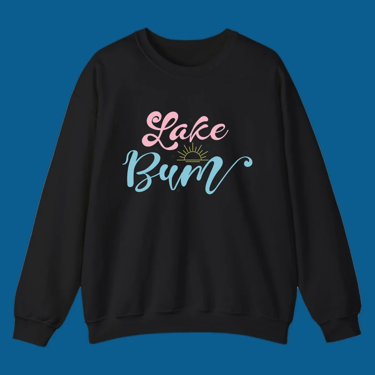 Lake Bum text design with a sunset graphic, in pink and blue script.