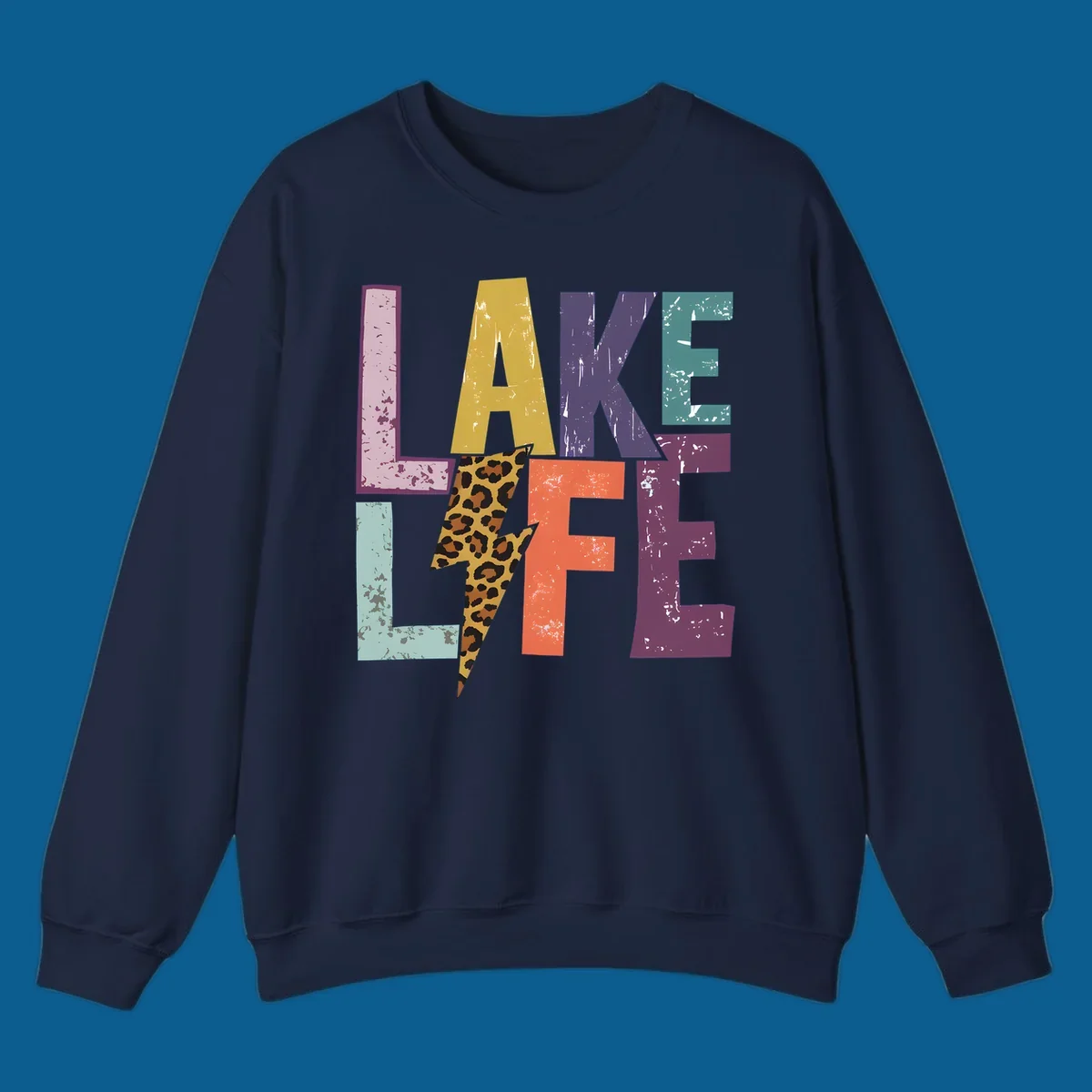 Distressed letters spelling LAKE LIFE with a leopard print lightning bolt, lake-life-style.