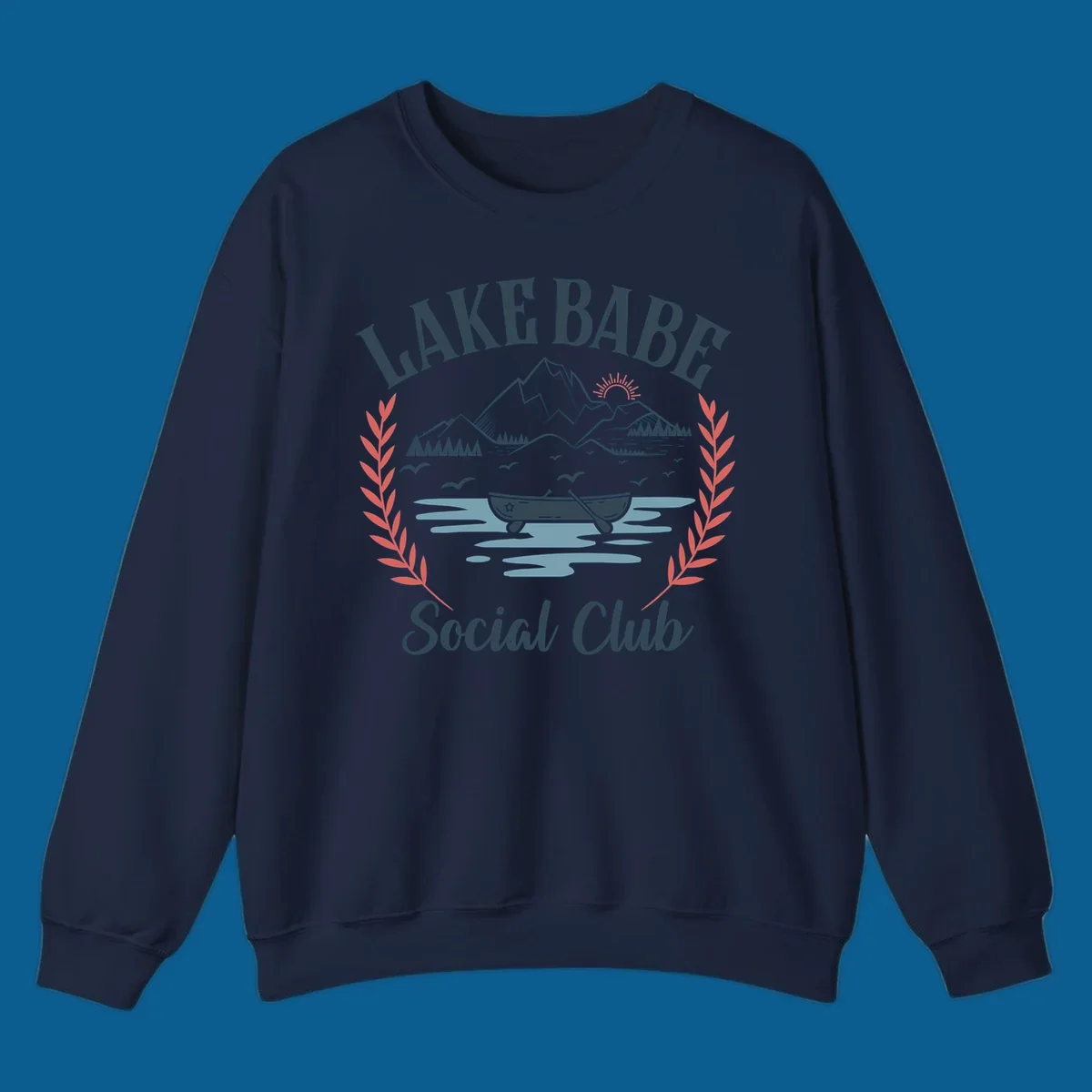 Lake Babe Social Club illustration with mountains, canoe, sun, and birds.