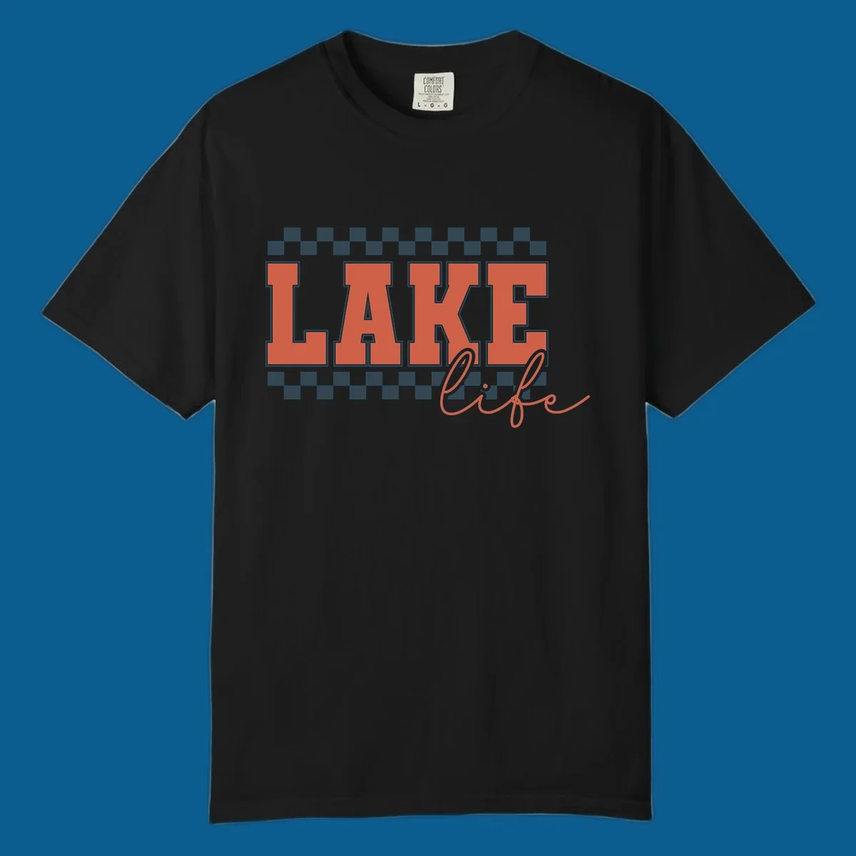 Coral block letters spelling LAKE with script "life" below, bordered by checkerboard. Lake life style.