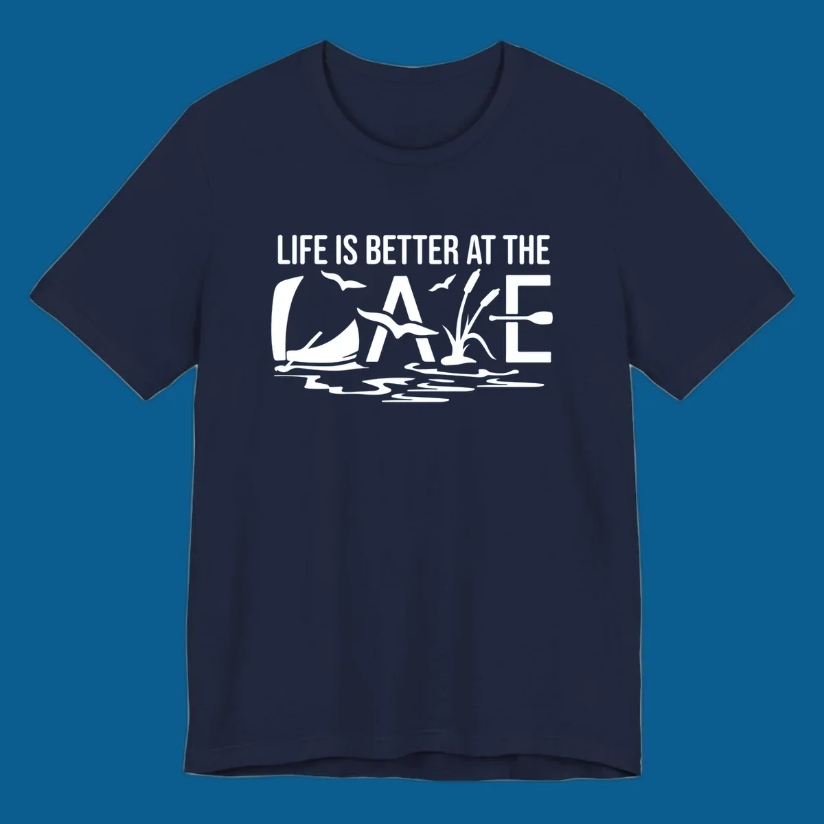 Life Is Better At The Lake design with sailboat, birds, reeds, paddle, and text.