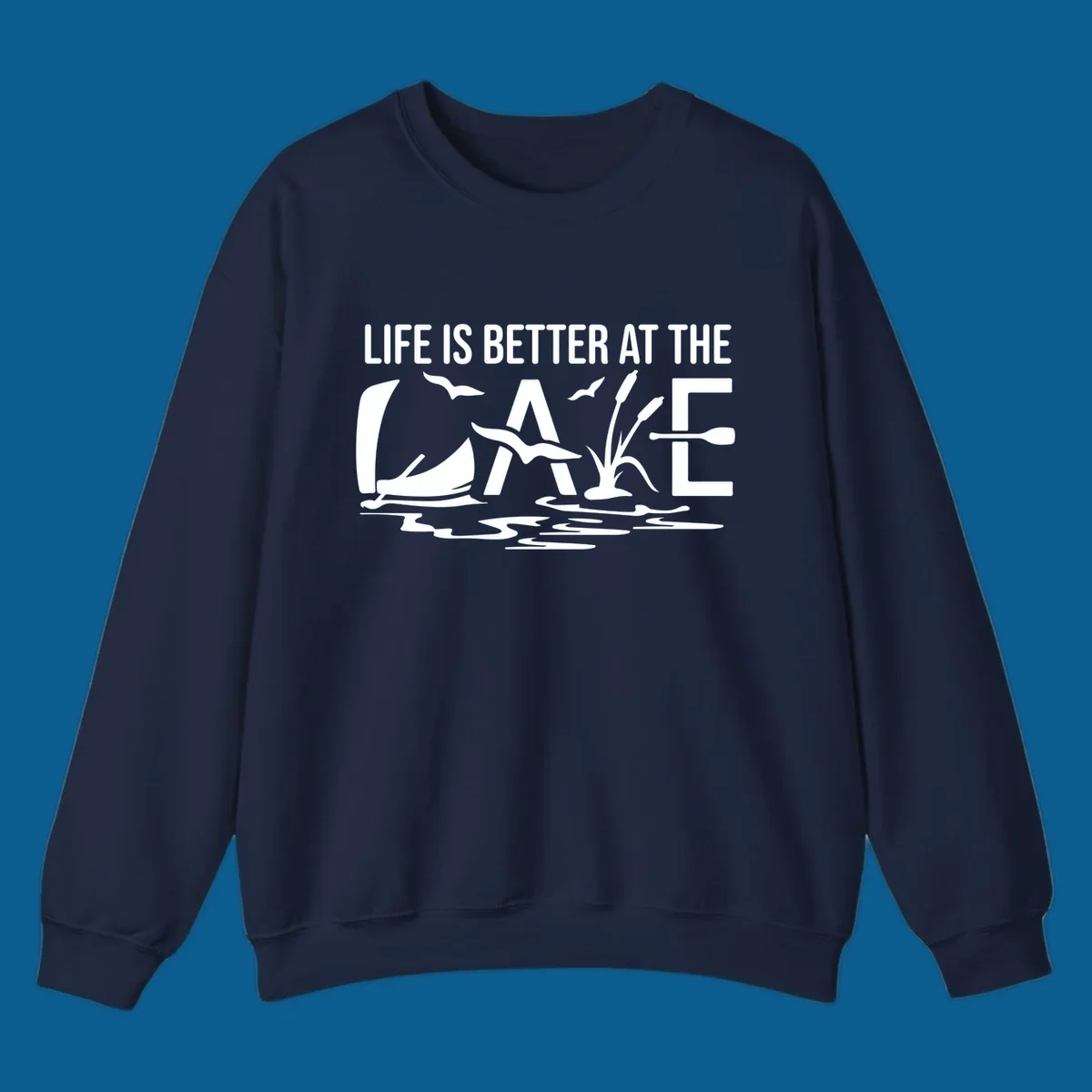 Life Is Better At The Lake design with sailboat, birds, reeds, paddle, and text.