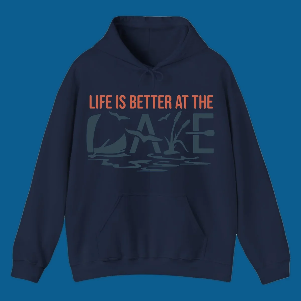 Graphic text design 'LIFE IS BETTER AT THE LAKE' with sailboat, birds, cattails, and paddle elements.