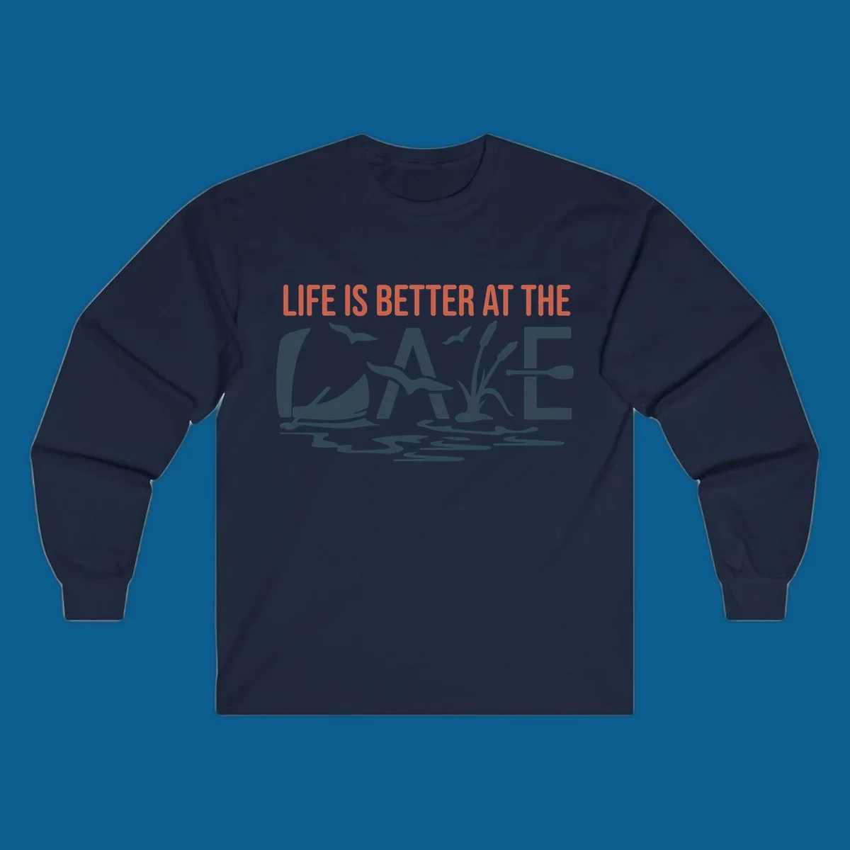 Graphic text design 'LIFE IS BETTER AT THE LAKE' with sailboat, birds, cattails, and paddle elements.