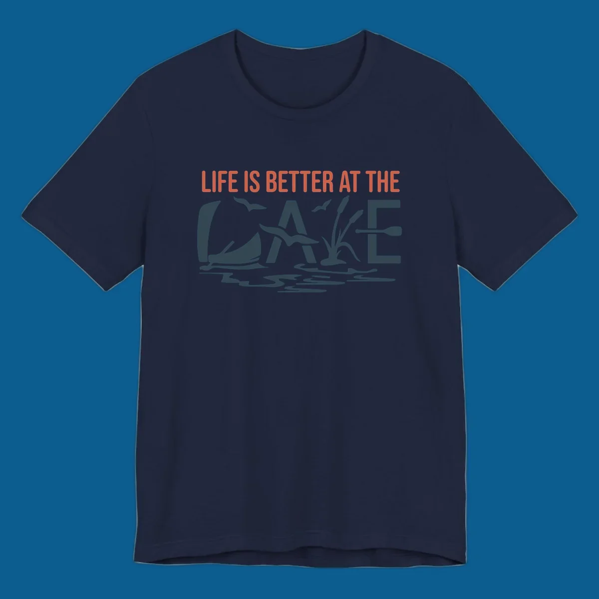 Graphic text design 'LIFE IS BETTER AT THE LAKE' with sailboat, birds, cattails, and paddle elements.