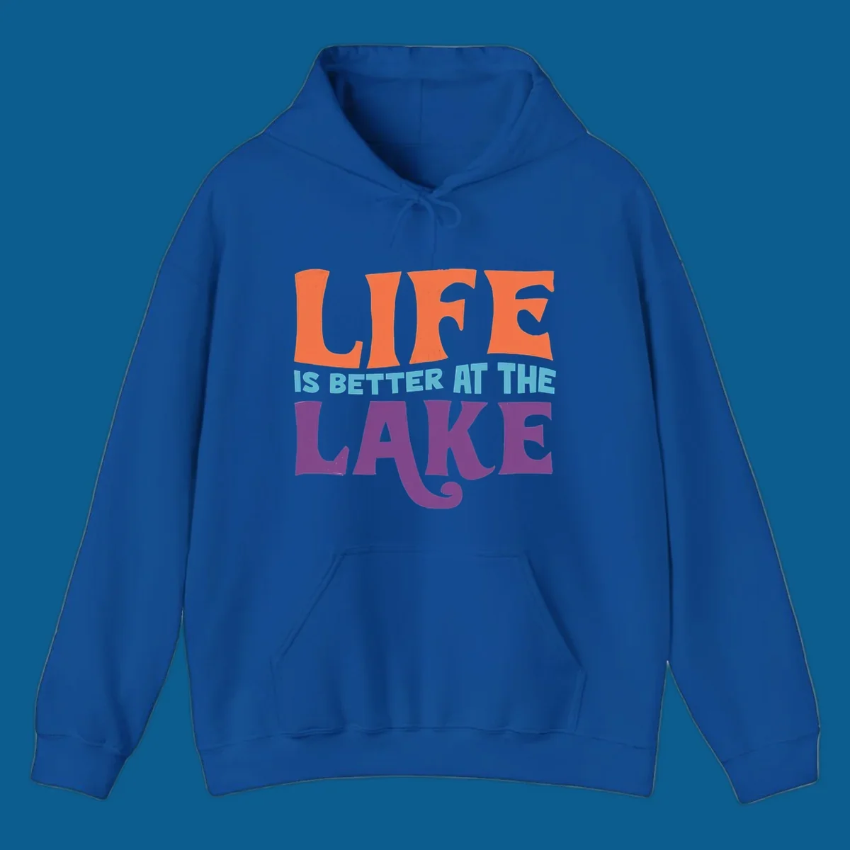 Retro typography design stating "LIFE IS BETTER AT THE LAKE" in orange, teal, and purple.