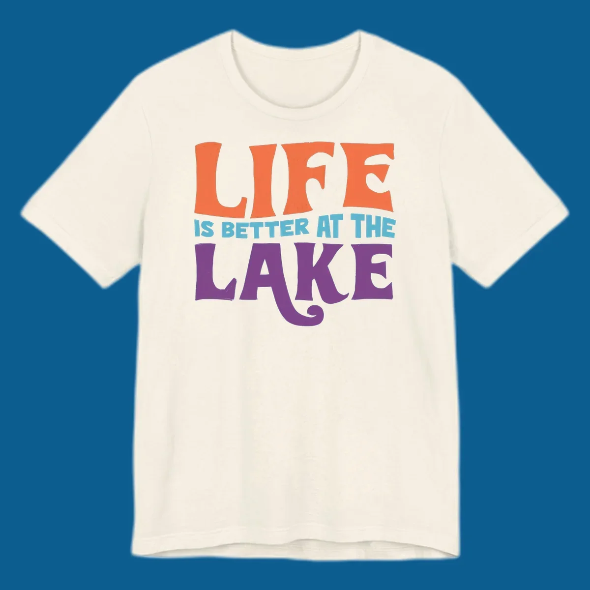 Retro typography design stating "LIFE IS BETTER AT THE LAKE" in orange, teal, and purple.
